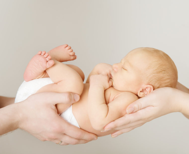 Baby in Parents' Hands