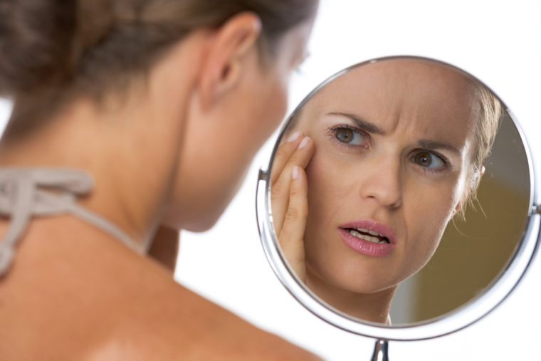 Woman looking in the mirror